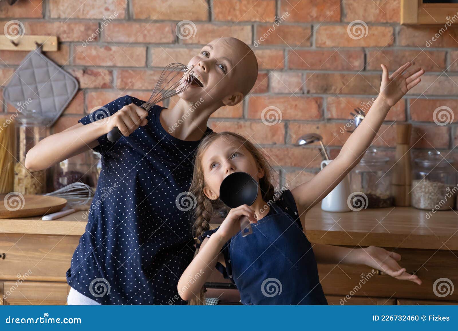 Excited Cancer Mom and Funny Little Daughter Playing Concert Stock Photo -  Image of dance, enjoy: 226732460