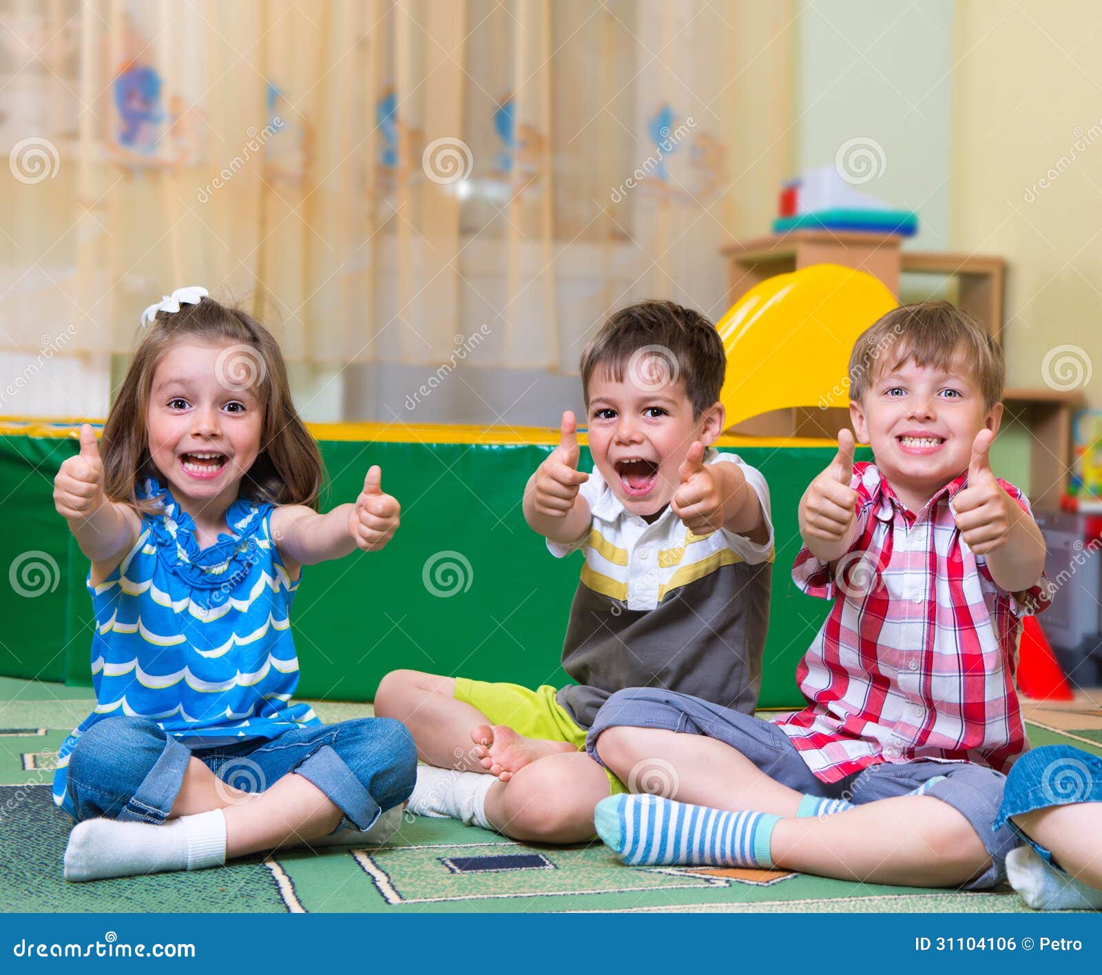 excited children holding thumbs up