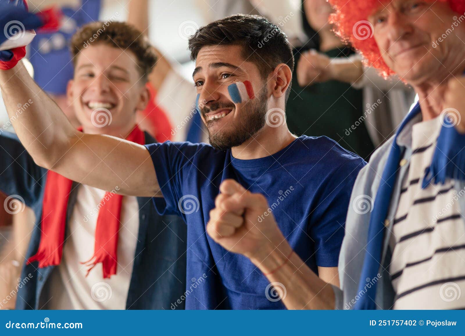 Excited Football Fans Supporting French National Team in Live Soccer