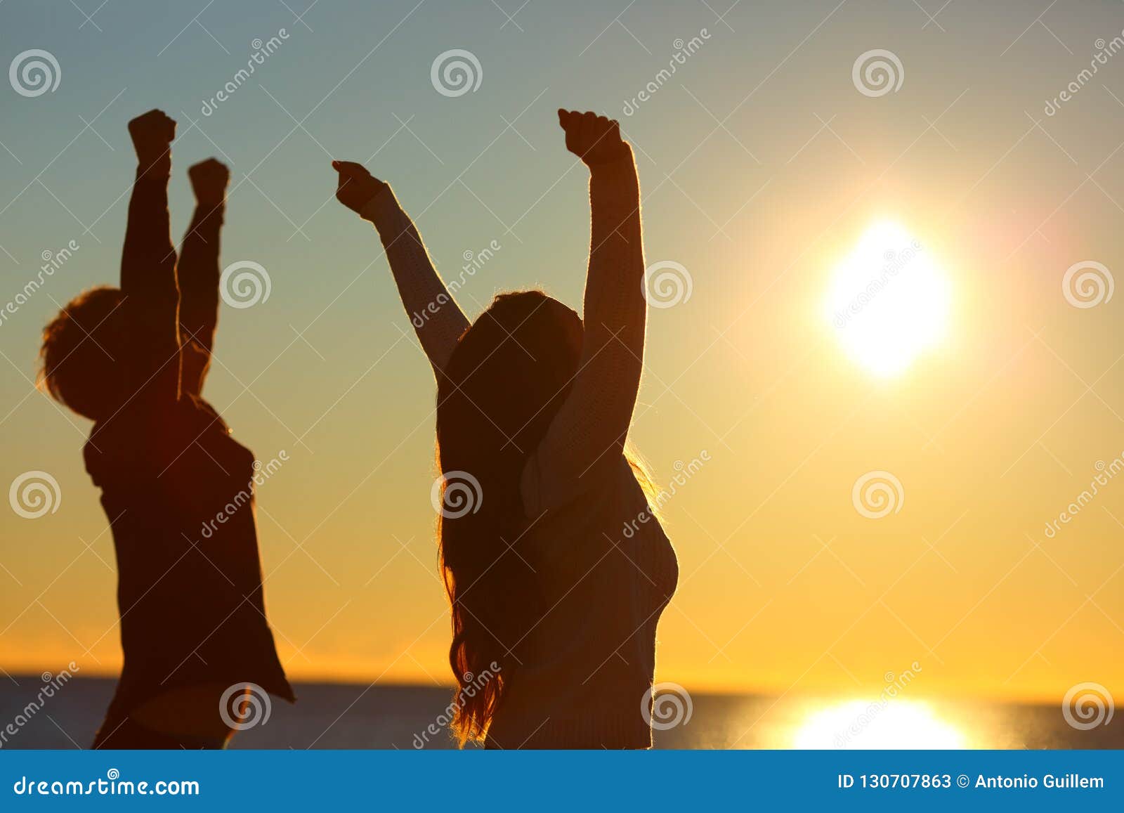 two friends interlocked arms silhouette two friends interlocked arms silhouette