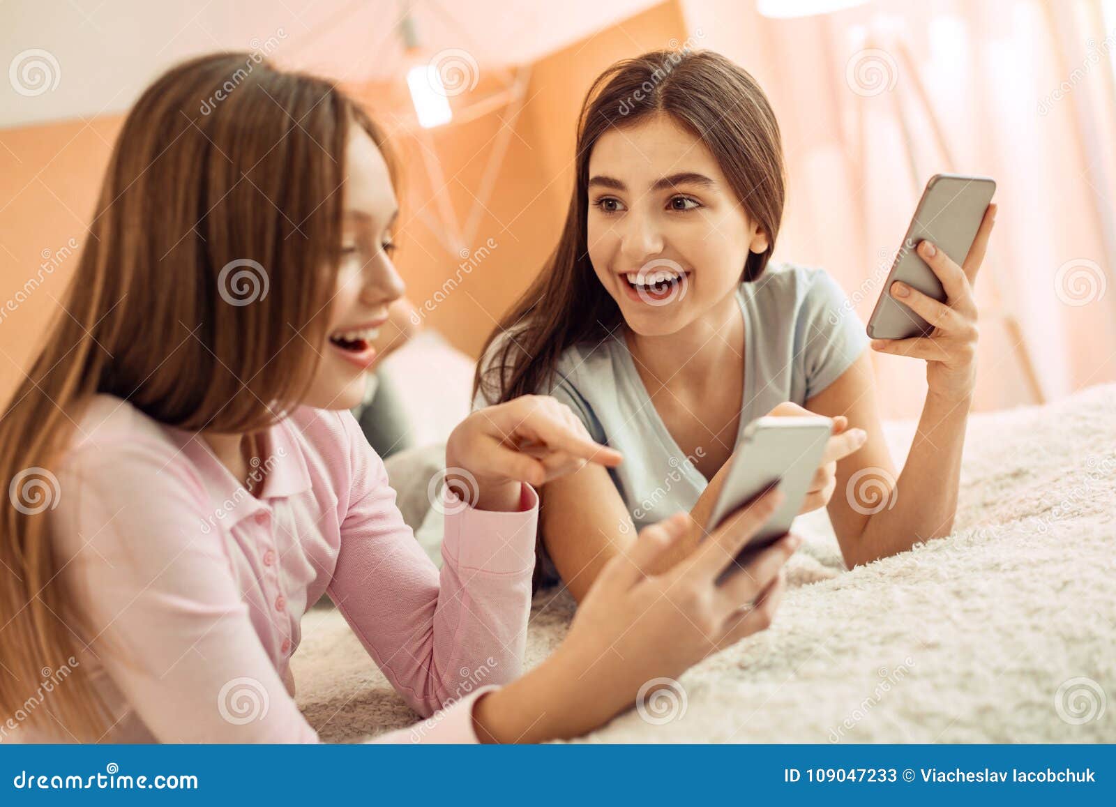 Excited Girl Showing Funny Post Online To Her Friend Stock Image - Image of family, phone: 109047233 Excited Girl Showing Funny Post Online To Her Friend Stock Image - Image of family, phone: 109047233