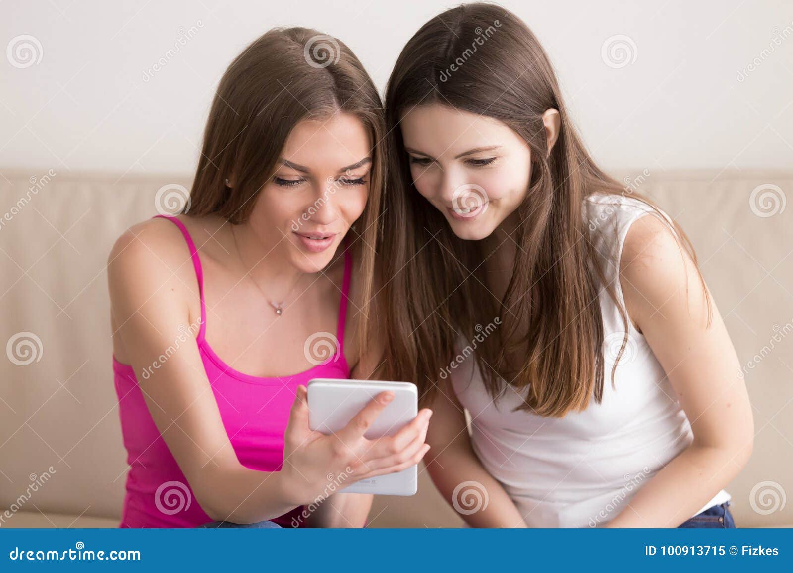 Excited Girl Showing Something Cool on Tablet To Her Friend. Stock ...