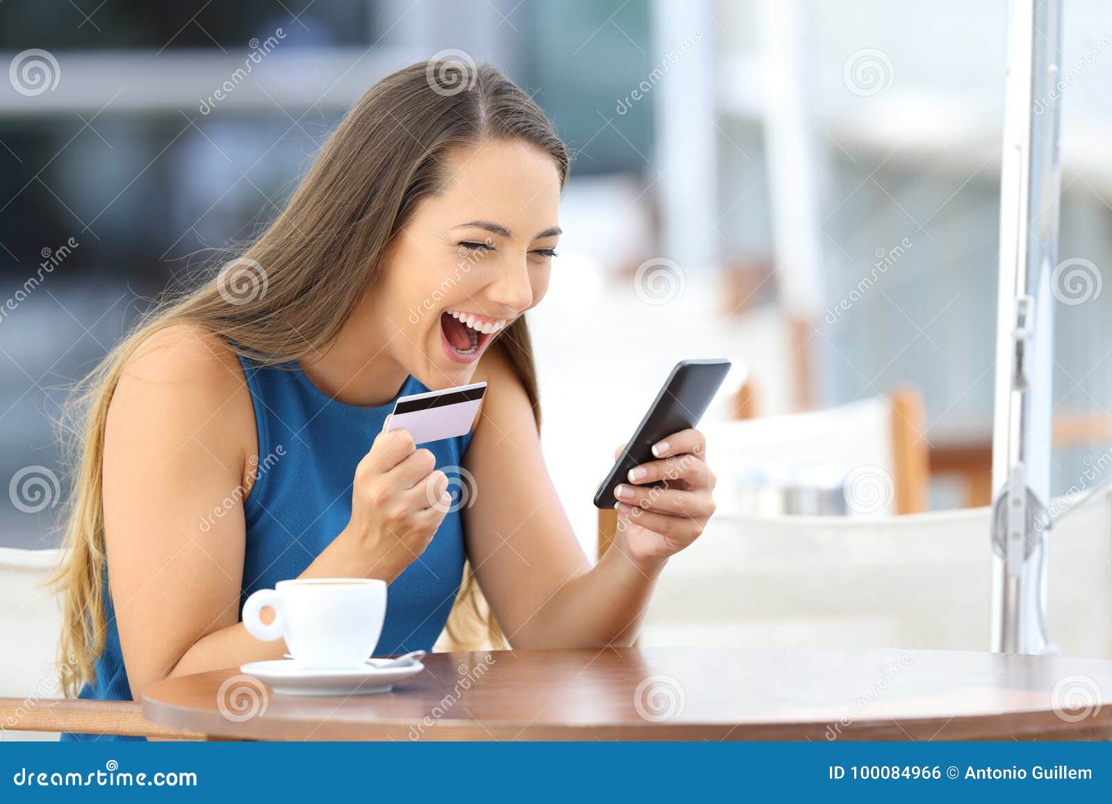 excited on line buyer paying with credit card