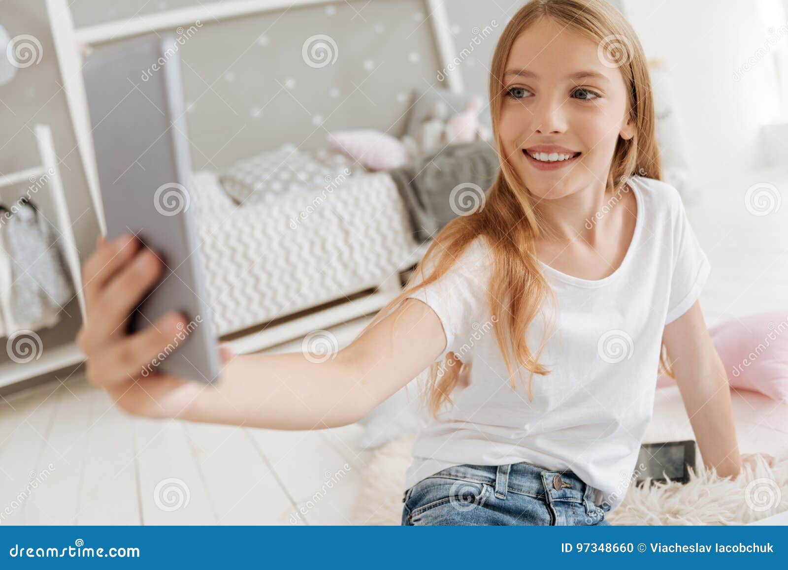 Excited Little Girl Taking Selfies in Her Bedroom Stock Photo - Image ...