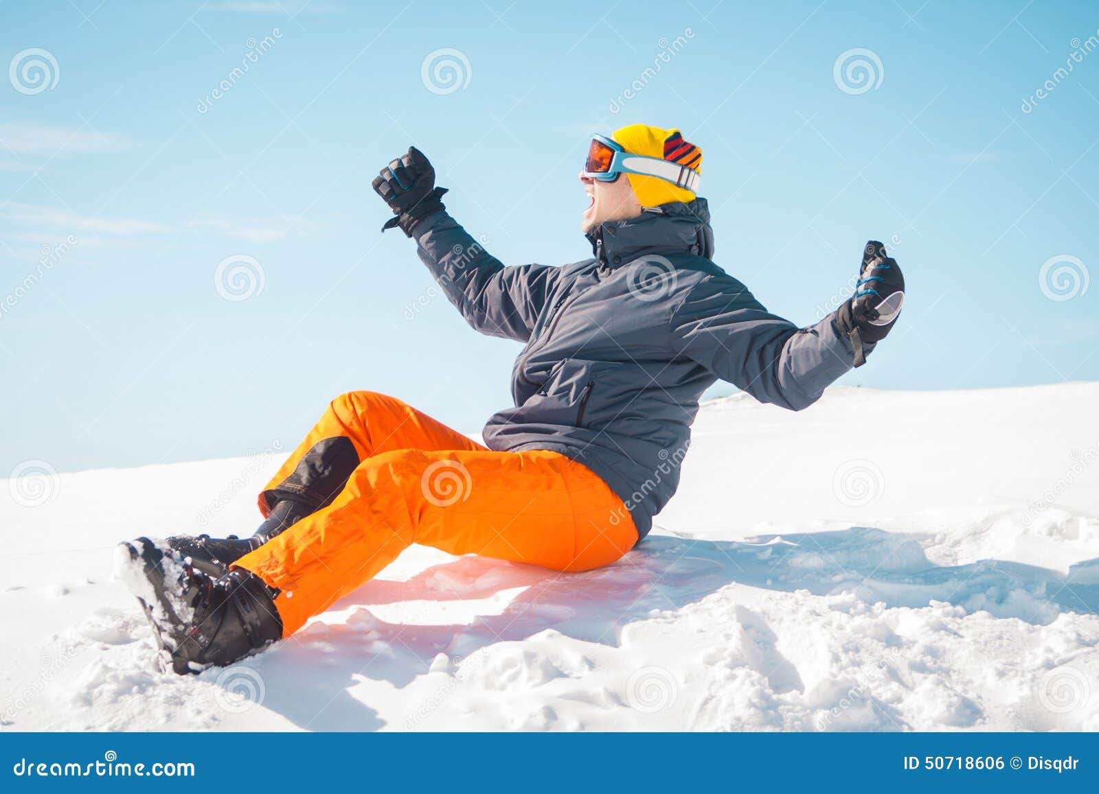 Excited Male Skier Sitting on Snow Stock Photo - Image of freedom ...