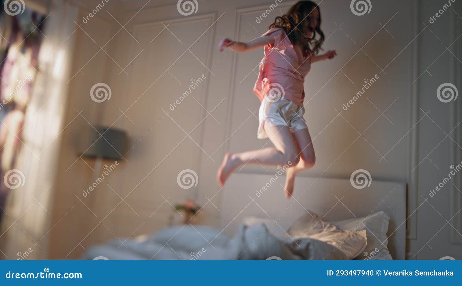 Excited Woman Jumping Bed In Morning Happy Beautiful Girl Dance Home excited-woman-jumping-bed-in-morning-happy-beautiful-girl-dance-home
