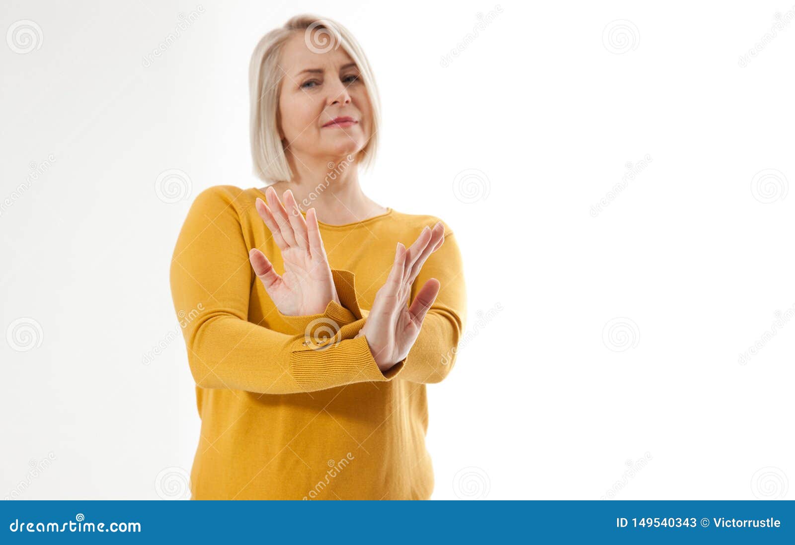 excited woman showing the sign of stop, neglect, negation and reluctance