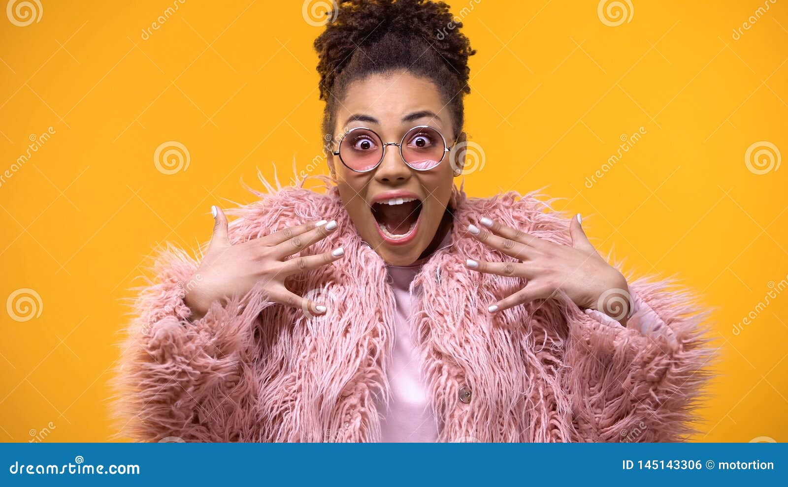 excited young woman on bright background, fashion trends, millennial glamour
