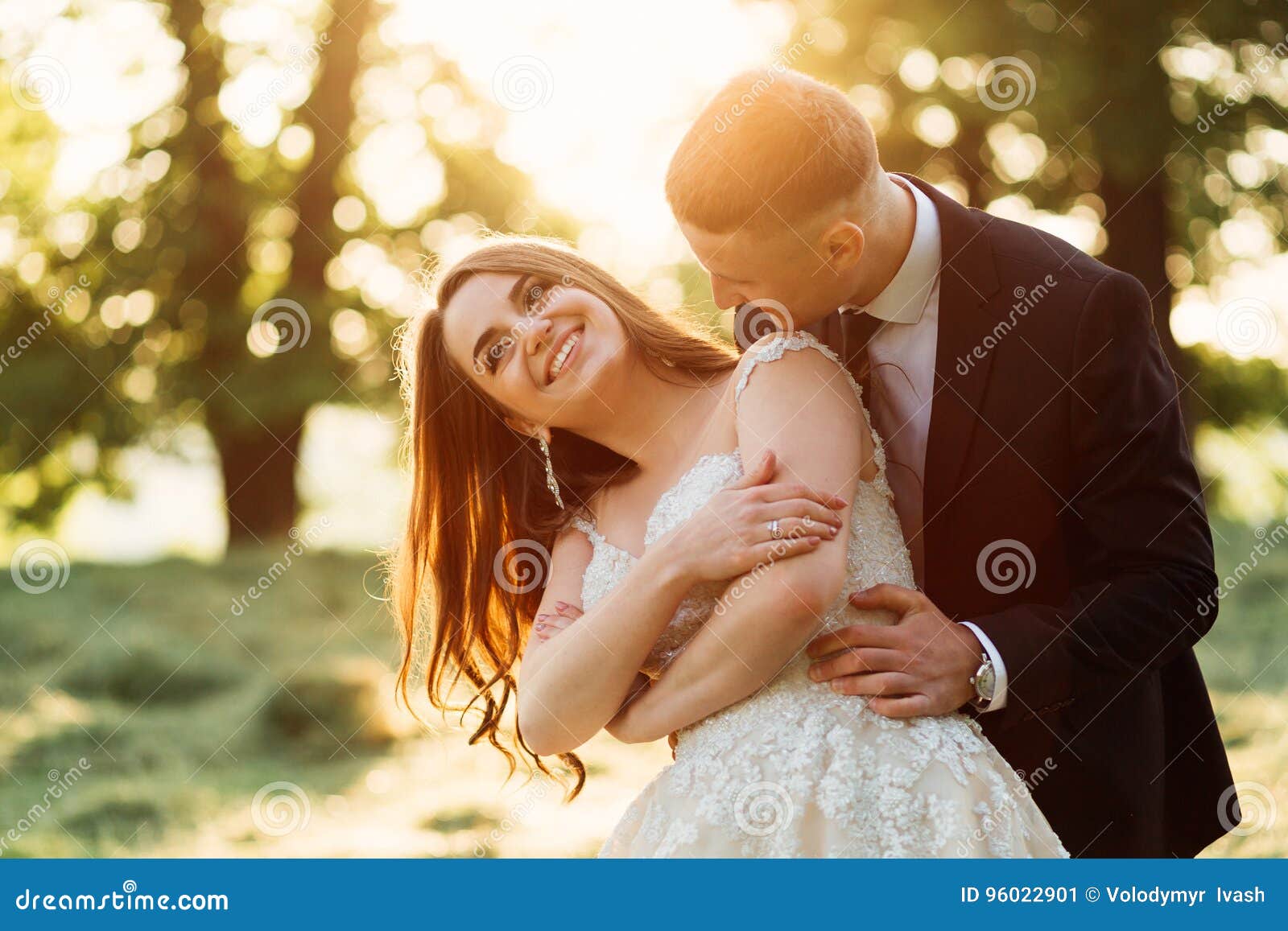 Exciting Bride Laughs Standing in Groom& X27;s Hugs Stock Image Image