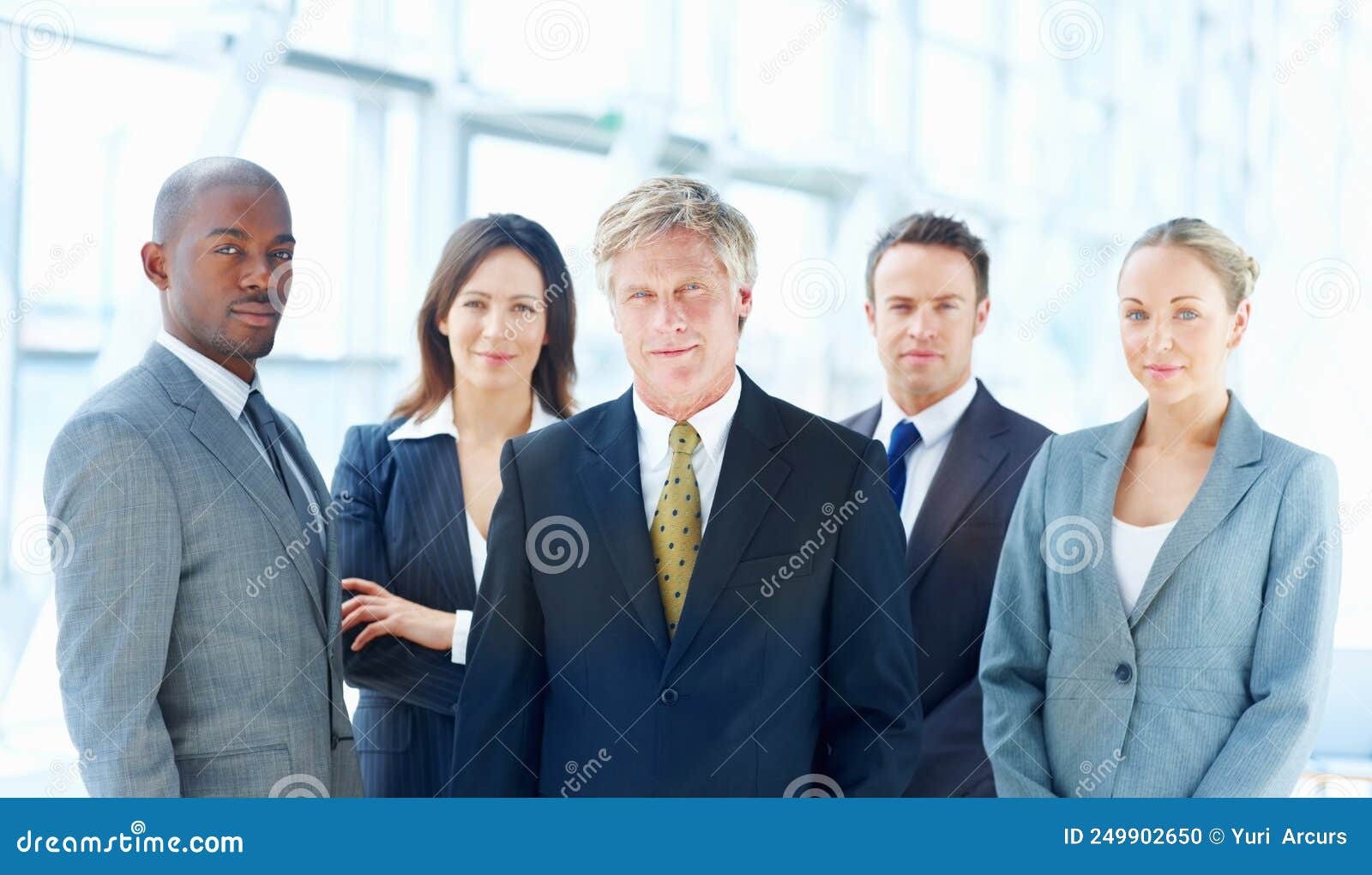 Executives Standing Together. Portrait of Multi Racial Executives Standing Together in Office
