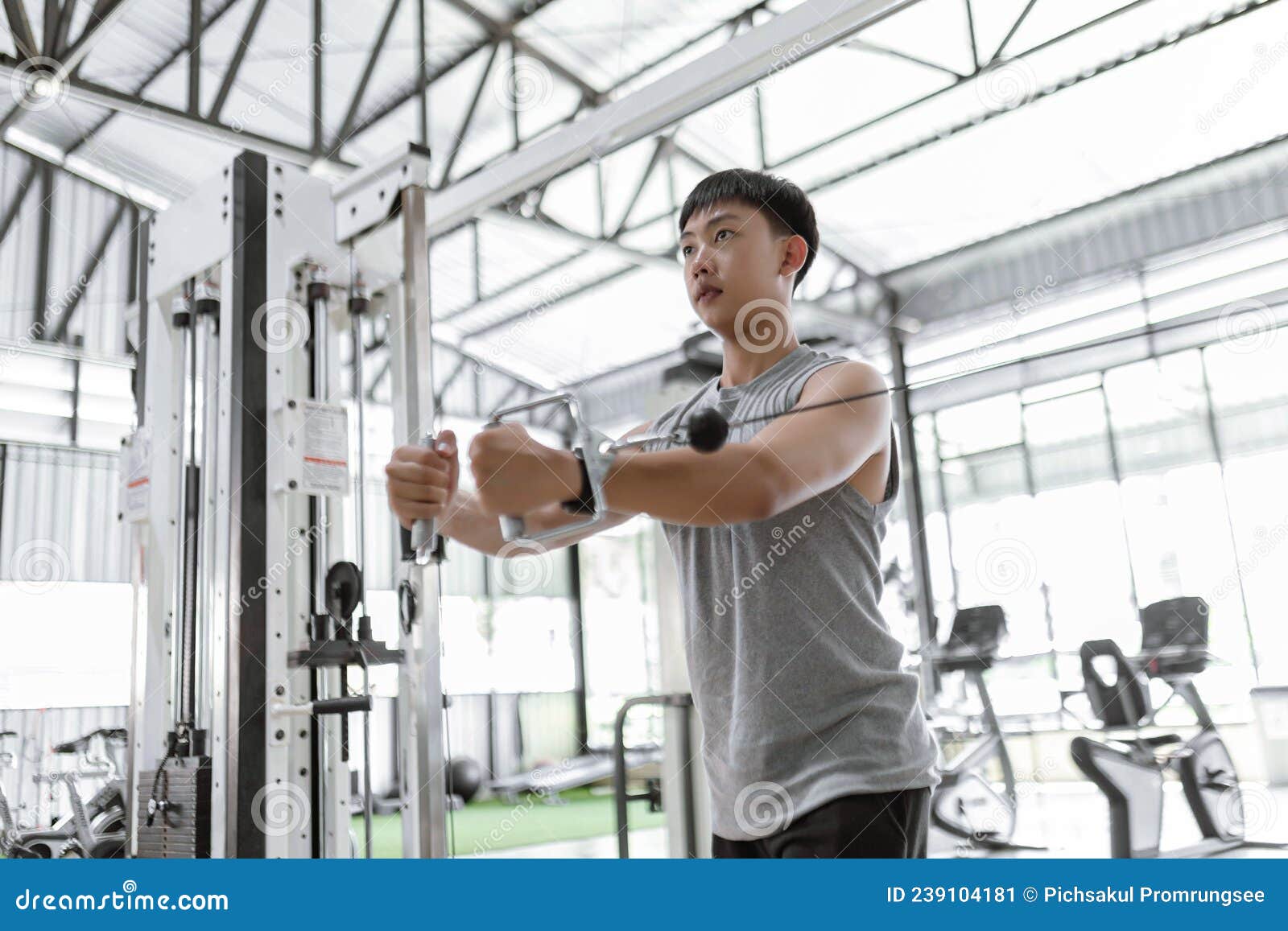 Exercise Concept the Male Working Out Club Subscriber Standing and Giving Focus on Doing Curl Pulling the Spring Rope Toward Stock Image Image of hard fist 239104181