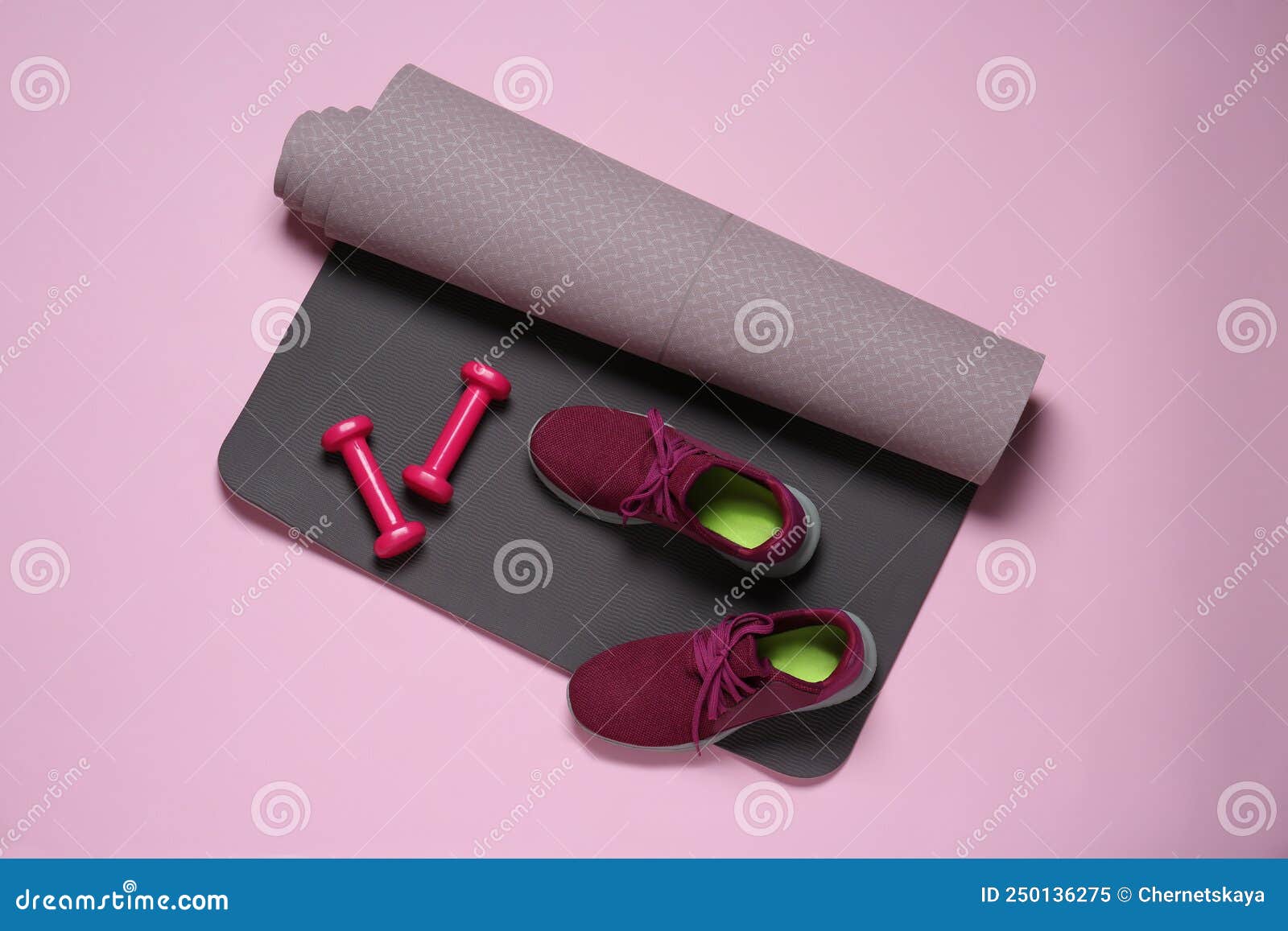 Exercise Mat, Dumbbells and Shoes on Pink Background, Flat Lay Stock ...