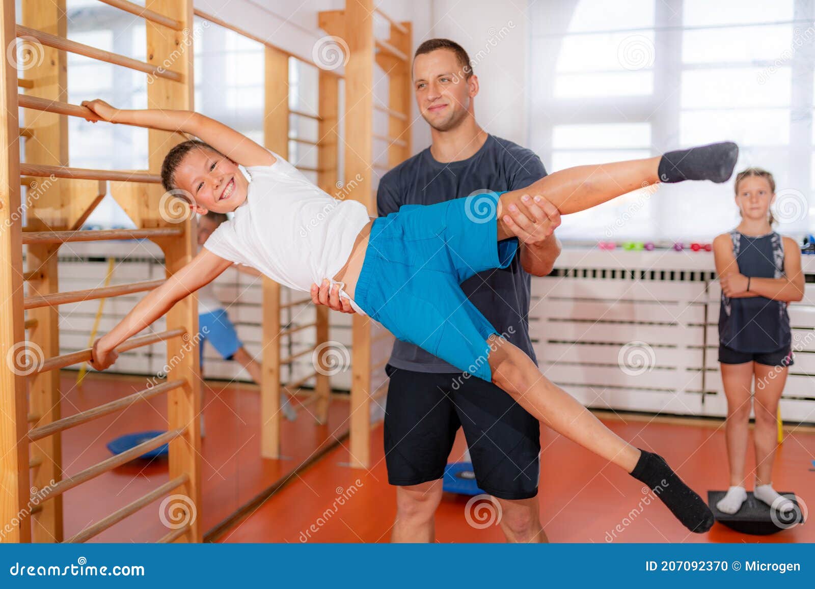 Exercises on Swedish Ladders, Strengthening of Abdominal Muscles Stock