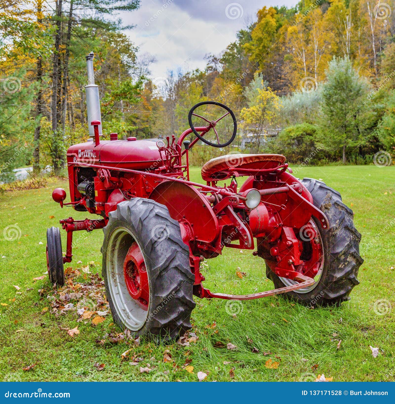 Exeter, New Hampshire October 13, 2018 Old Red Tractor Sits in Yard