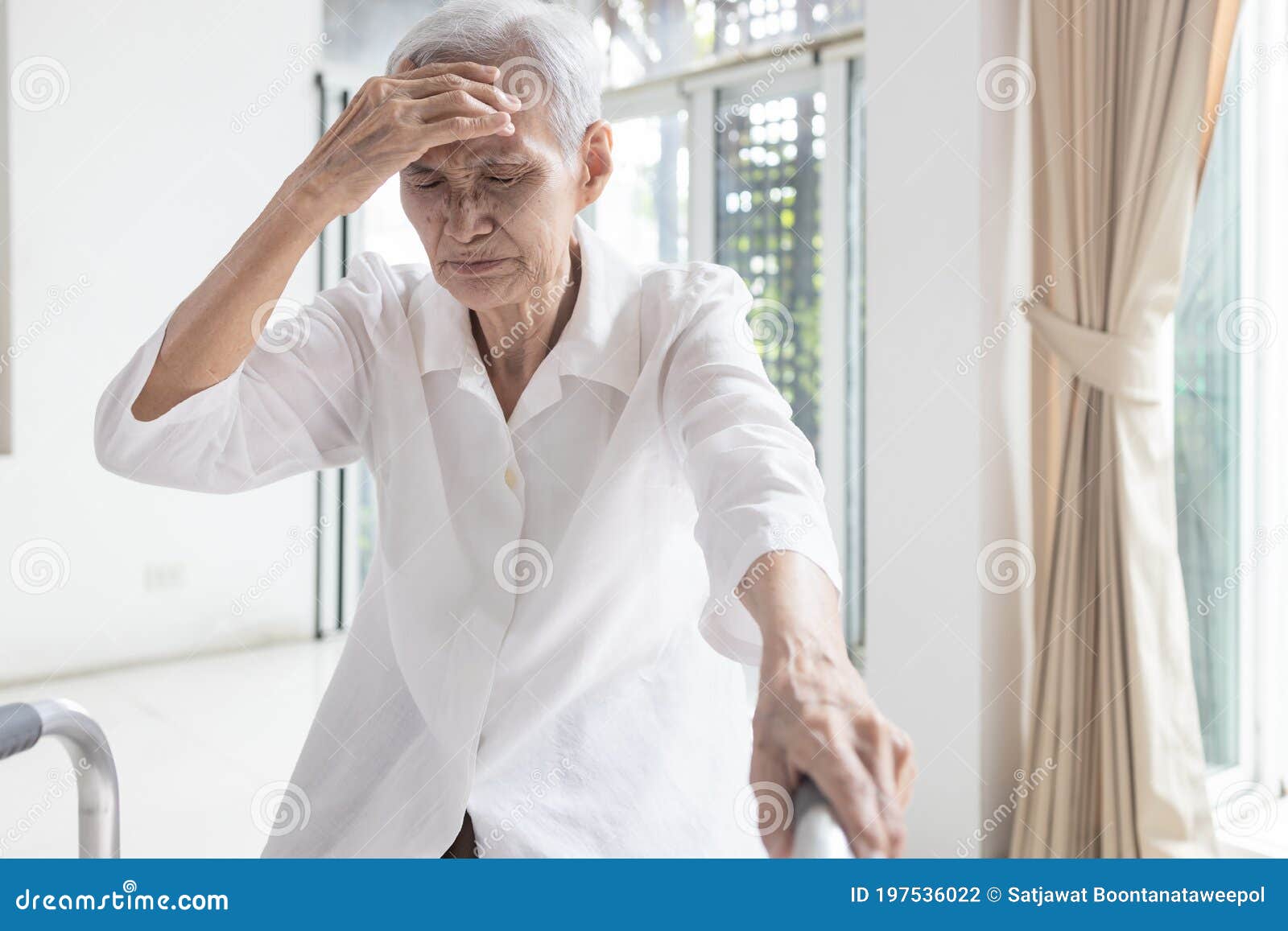 exhausted asian senior woman is touching her head with hand,symptoms of vertigo illness,loss balance dizzy,meniereÃ¢â¬â¢s disease,