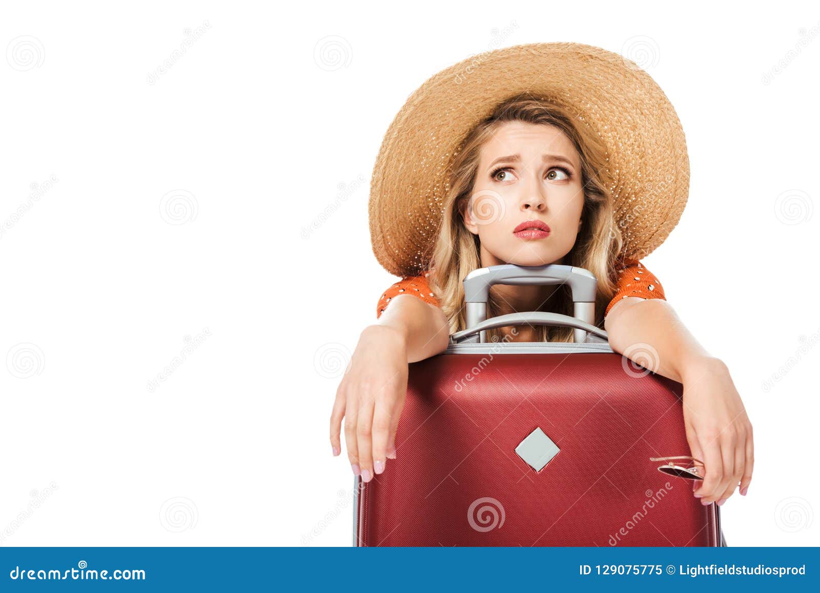 exhausted beautiful leaning on travel bag and looking up