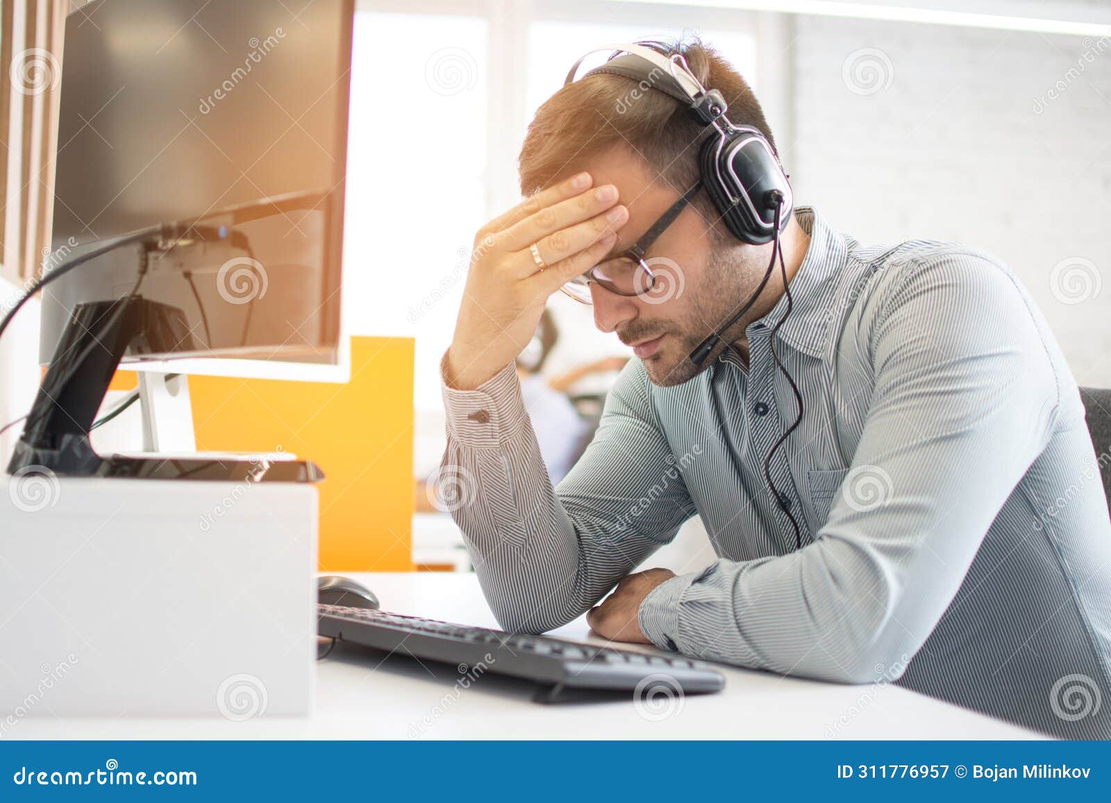 Exhausted Business Man Suffering from Eye Strain or Blurry Vision