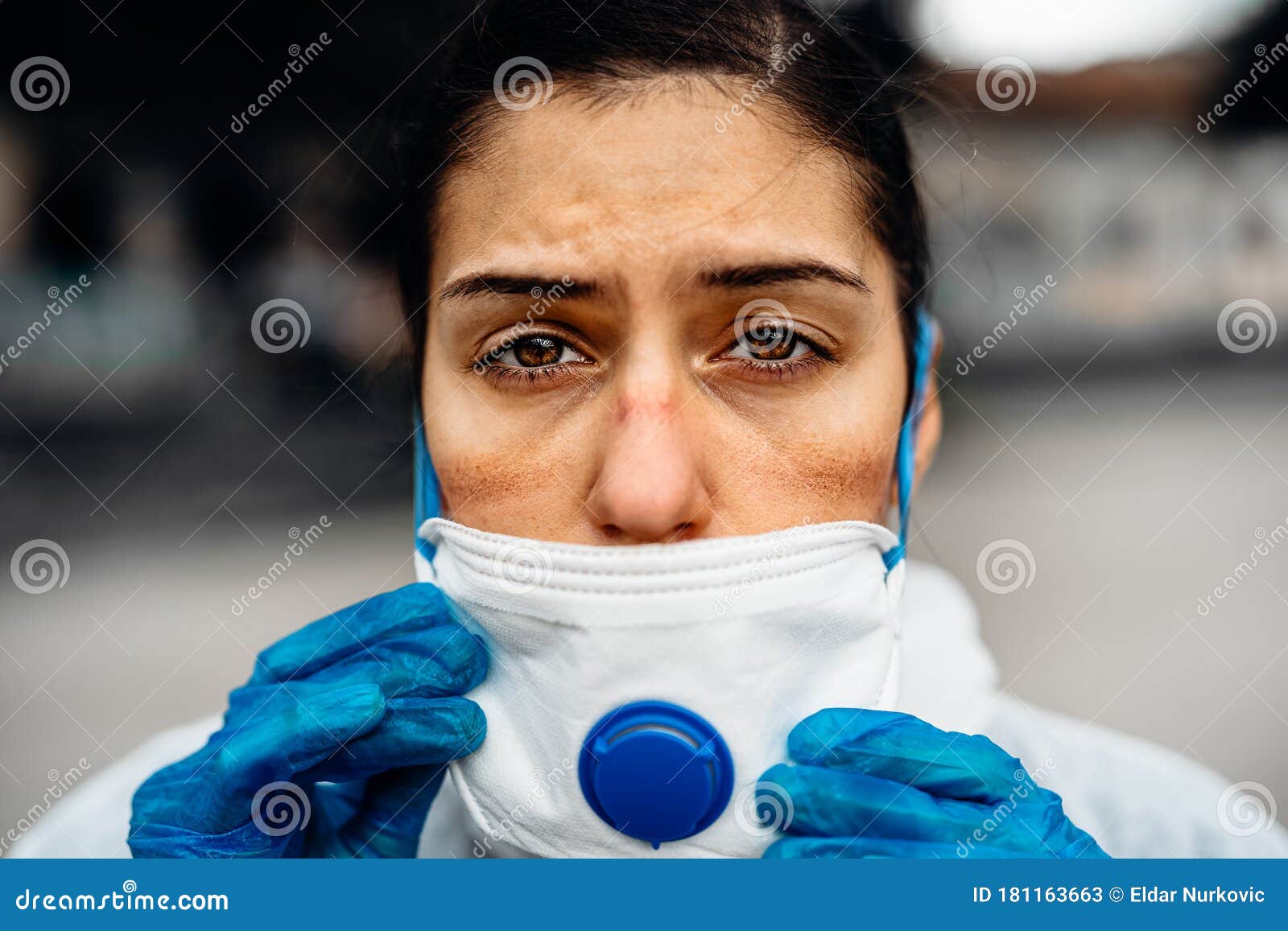 exhausted doctor/nurse wearing coronavirus protective gear n95 mask uniform.coronavirus covid-19 outbreak.mental stress of