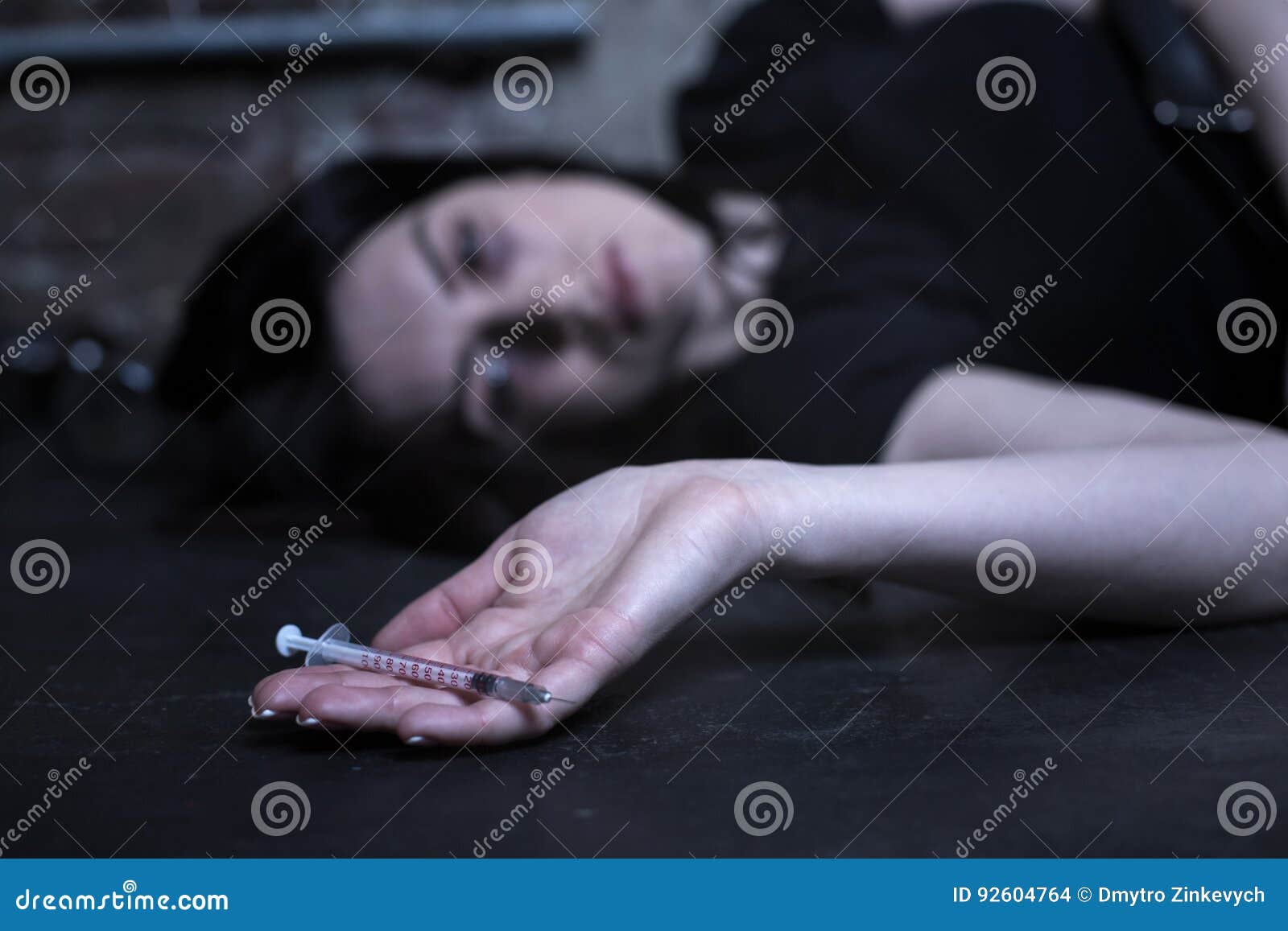 Exhausted Drug Addict Lying on the Ground Stock Photo - Image of ...