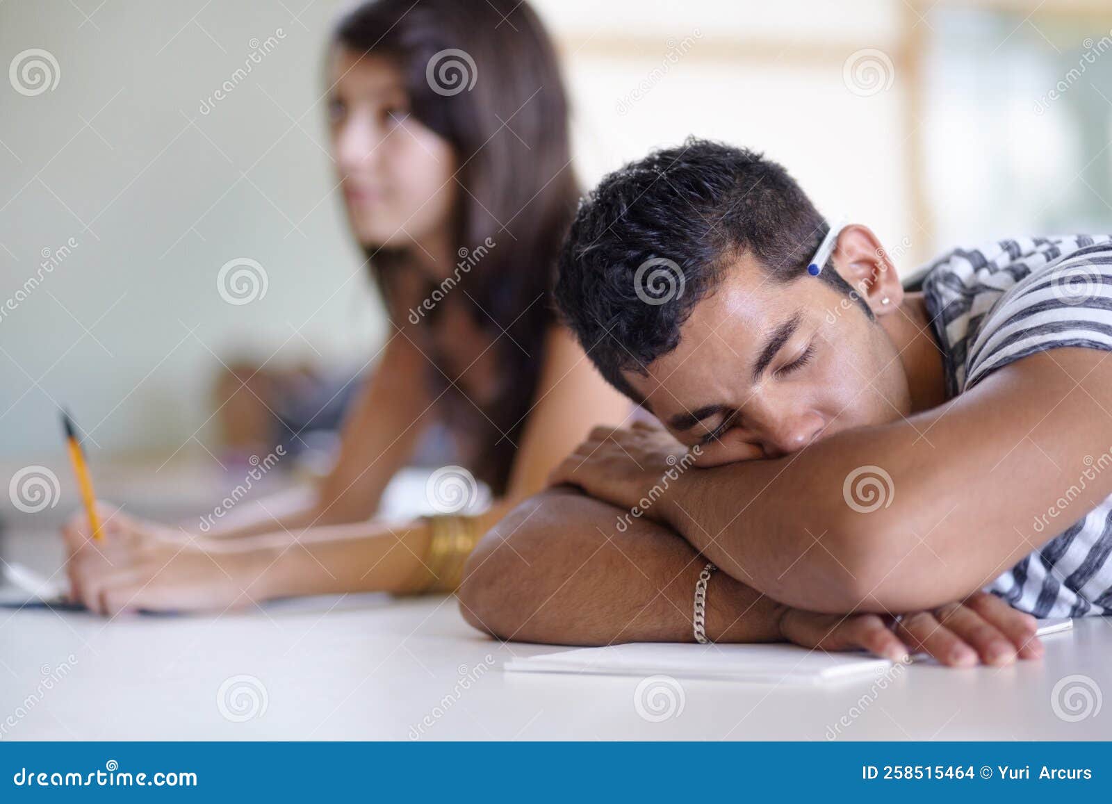Exhausted in His Final Period. a Young Ethnic Man Sleeping in Class