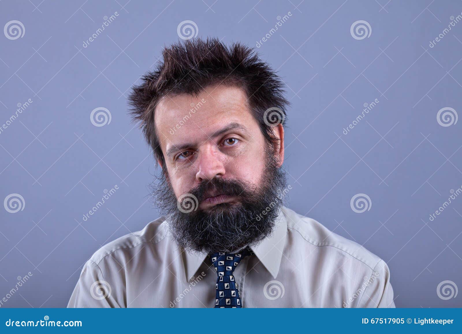 exhausted man with bushy hair and beard