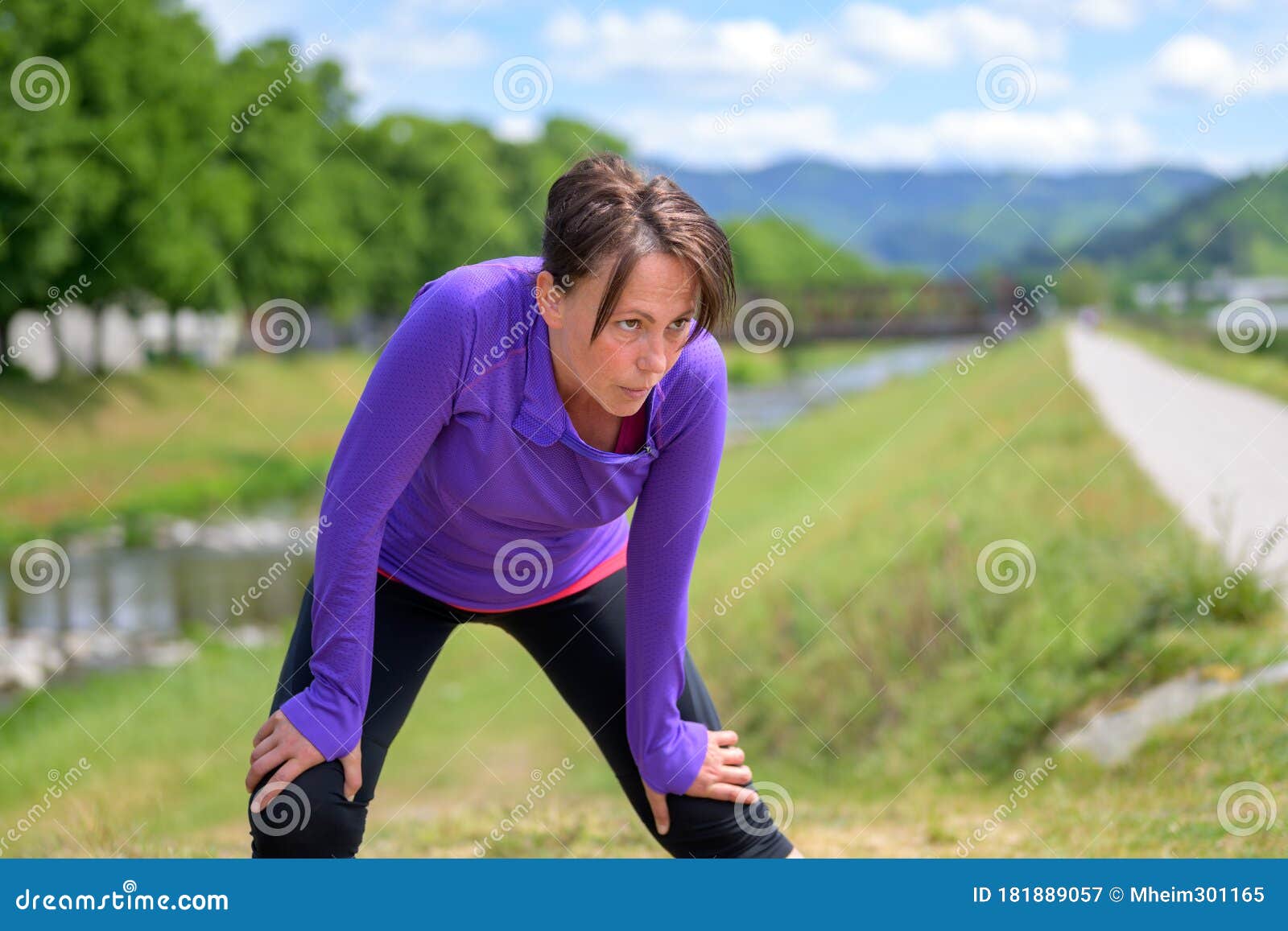 Exhausted Woman Jogger Taking A Break Stock Image I