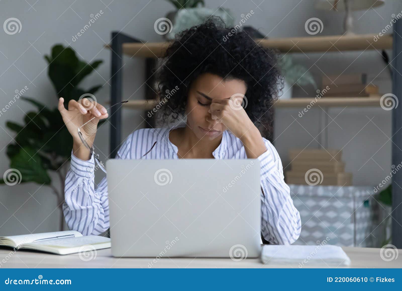 tired african american woman worker suffer from headache