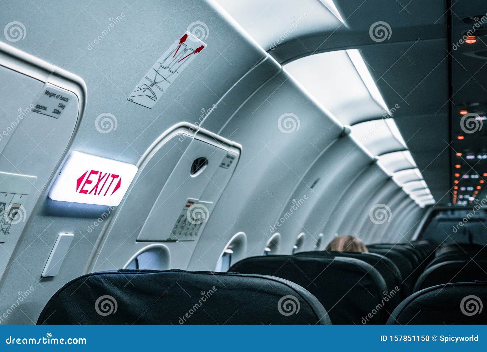 The Exit Sign Inside The Aircraft And Cabin Lights Stock Photo Image of salon, airline 157851150