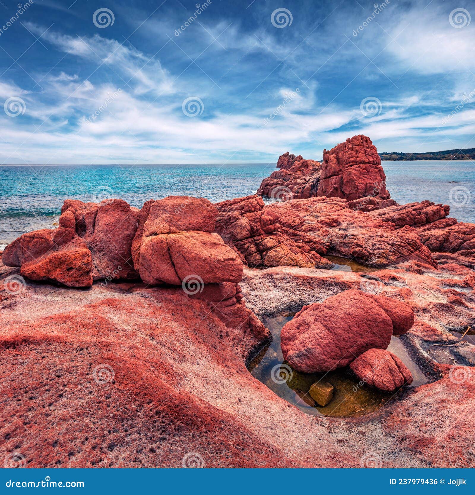 exotic red rocks gli scogli rossi - faraglioni cliffs on di cea beach.