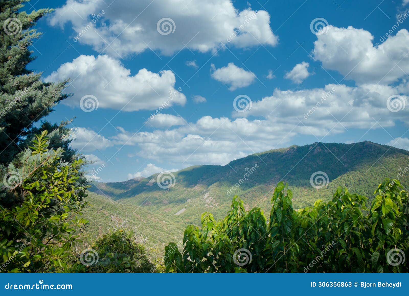 expansive view of ardeche mountains under a cloudy sky
