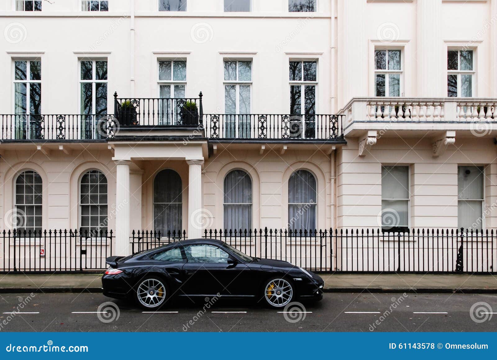 expensive car in a posh london neighborhood