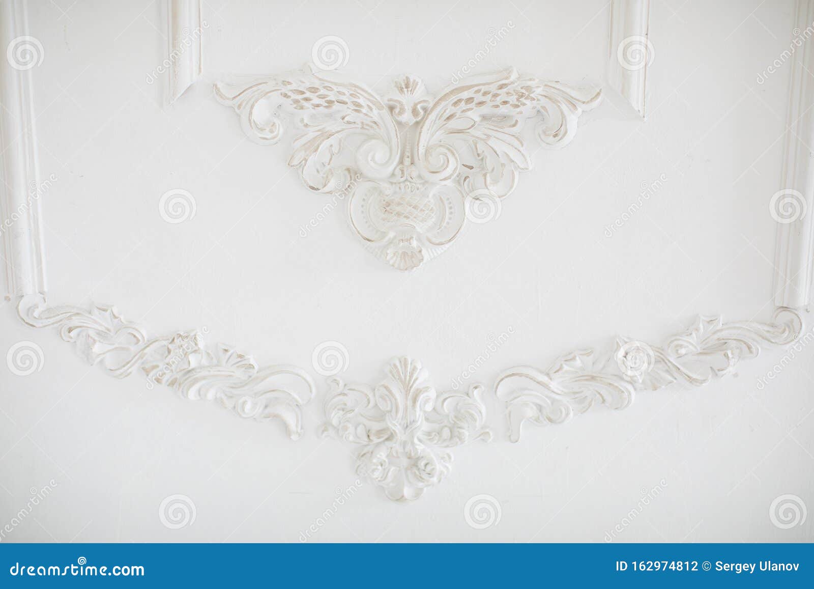 Expensive Interior. Stucco Elements on Light Luxury Wall. White