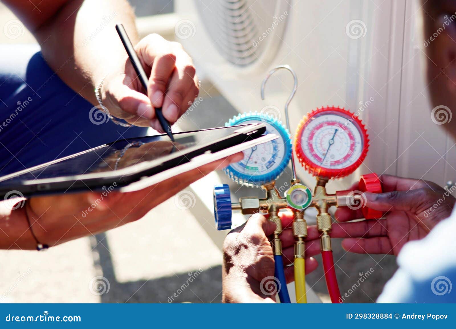 Experienced Air Conditioning Technician Repairing Heat Pump Stock Photo