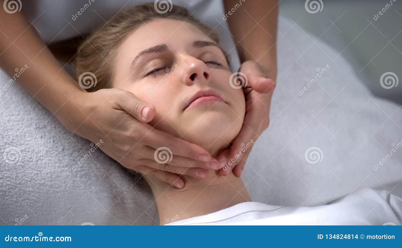 Experienced Cosmetologist Making Girl Relaxing Face Massage Treatments