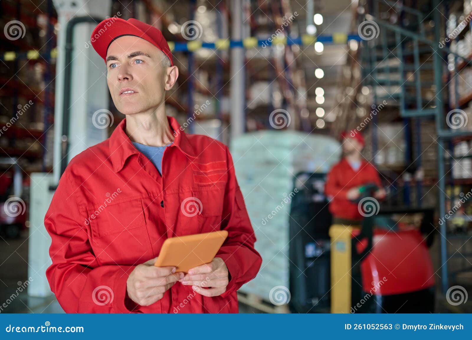 Experienced Staff Working in a Distribution Warehouse Stock Image