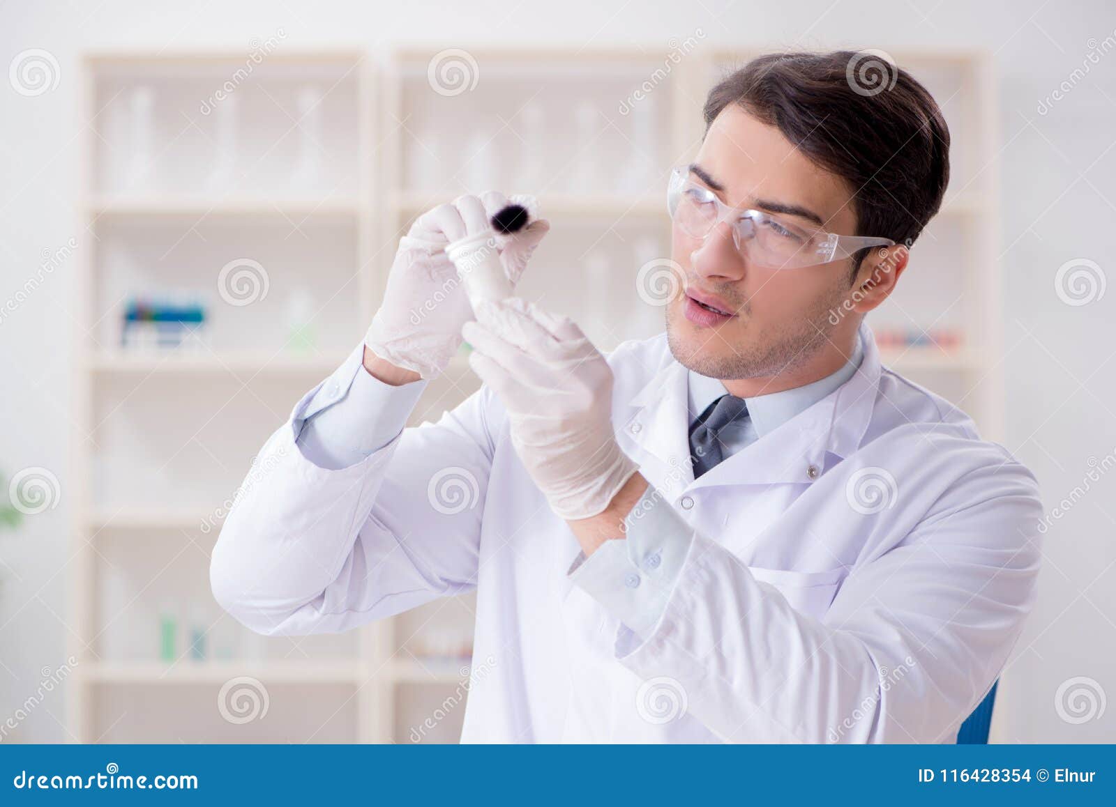 the expert criminologist working in the lab for evidence