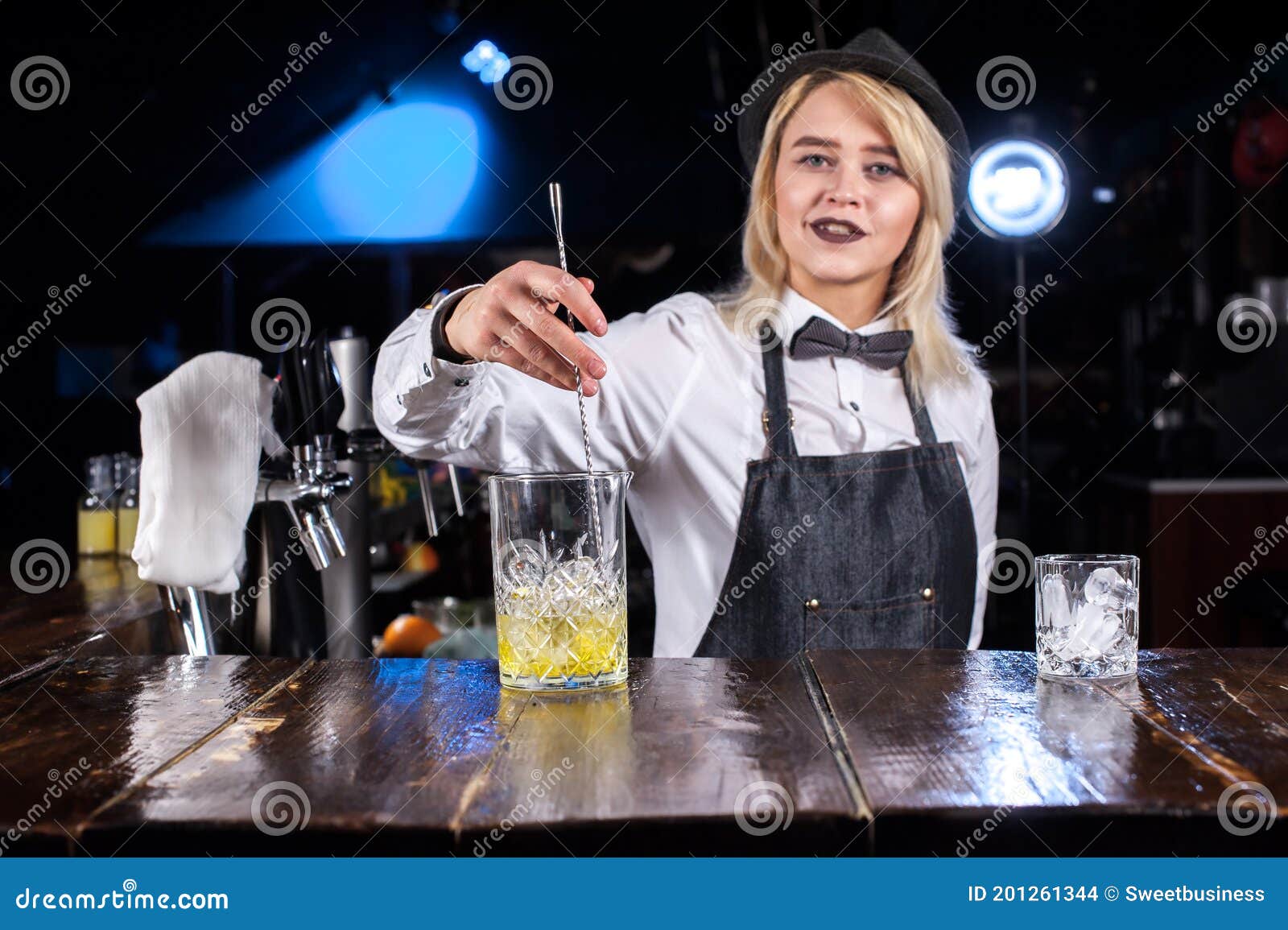 Professional Woman Mixologist Creates a Cocktail while Standing Near ...