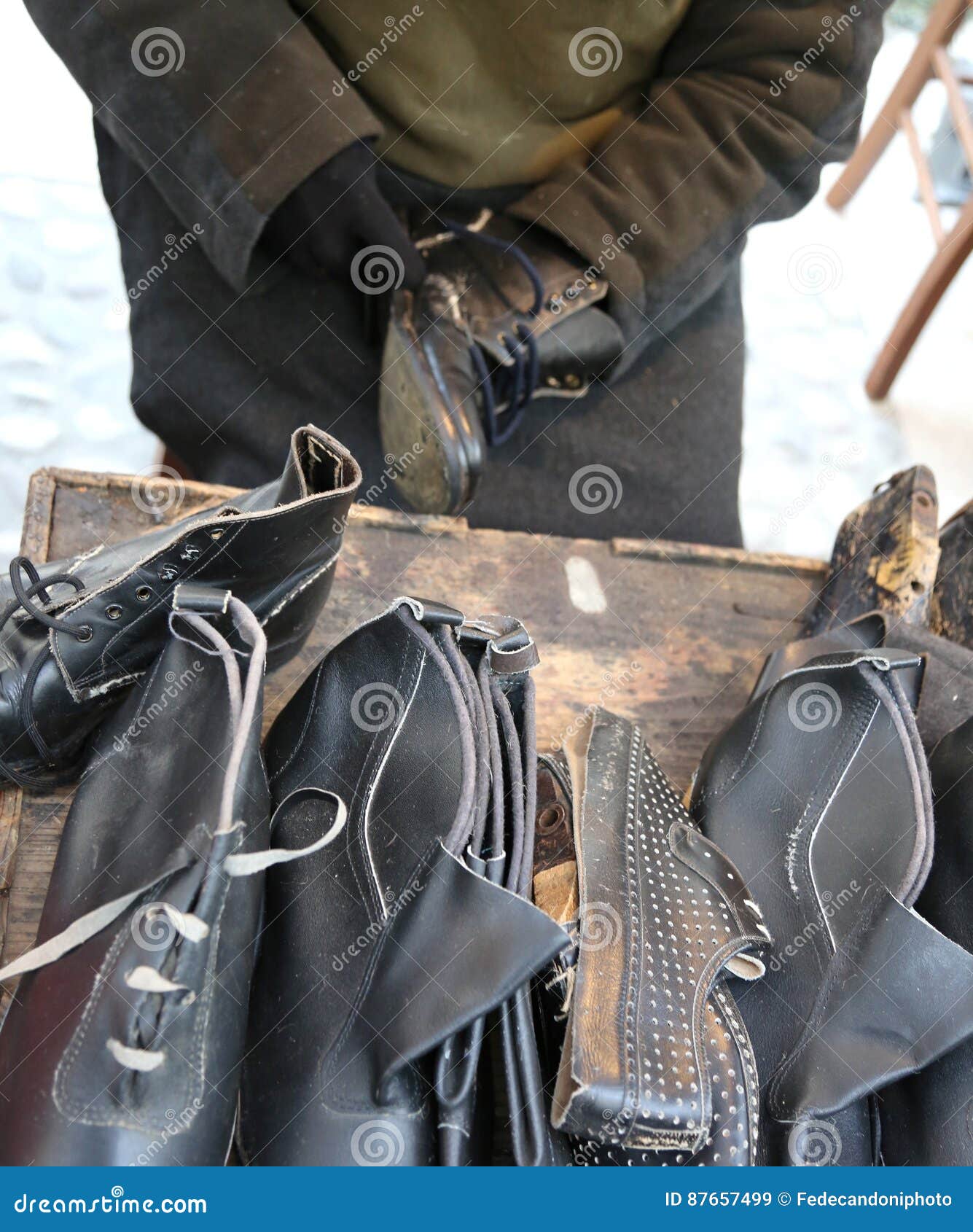 Expert Shoemaker while Repairing an Old Leather Shoe Stock Image