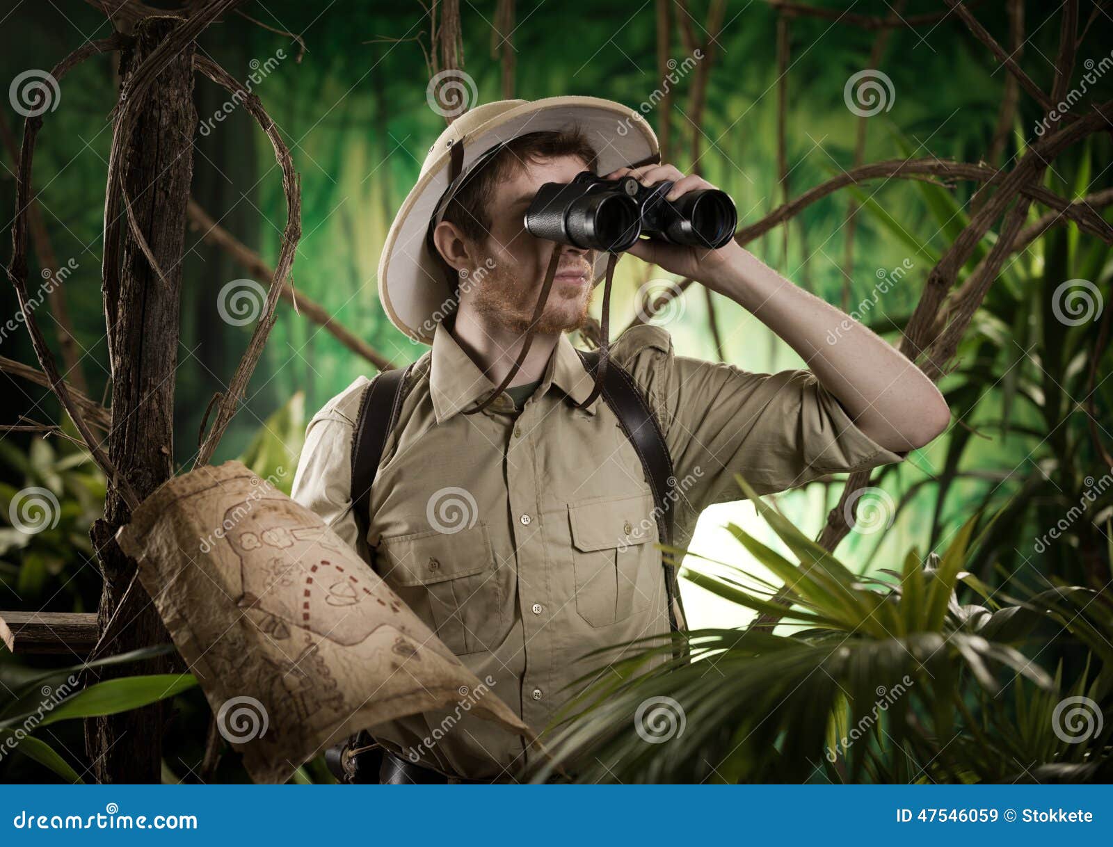 explorer in the jungle with binoculars