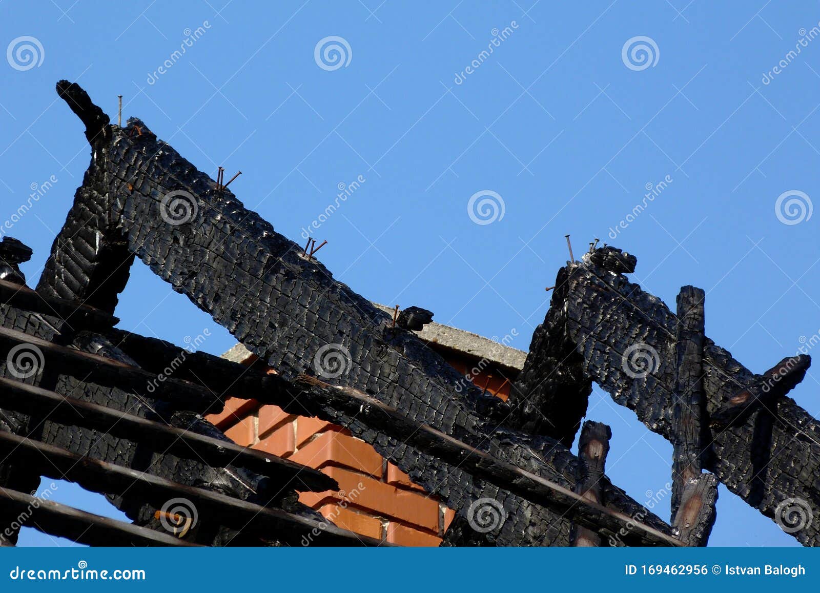 Black Charred Burnt Wooden Roof Rafters After Fire Under Blue Sky Stock Photo Image of frame