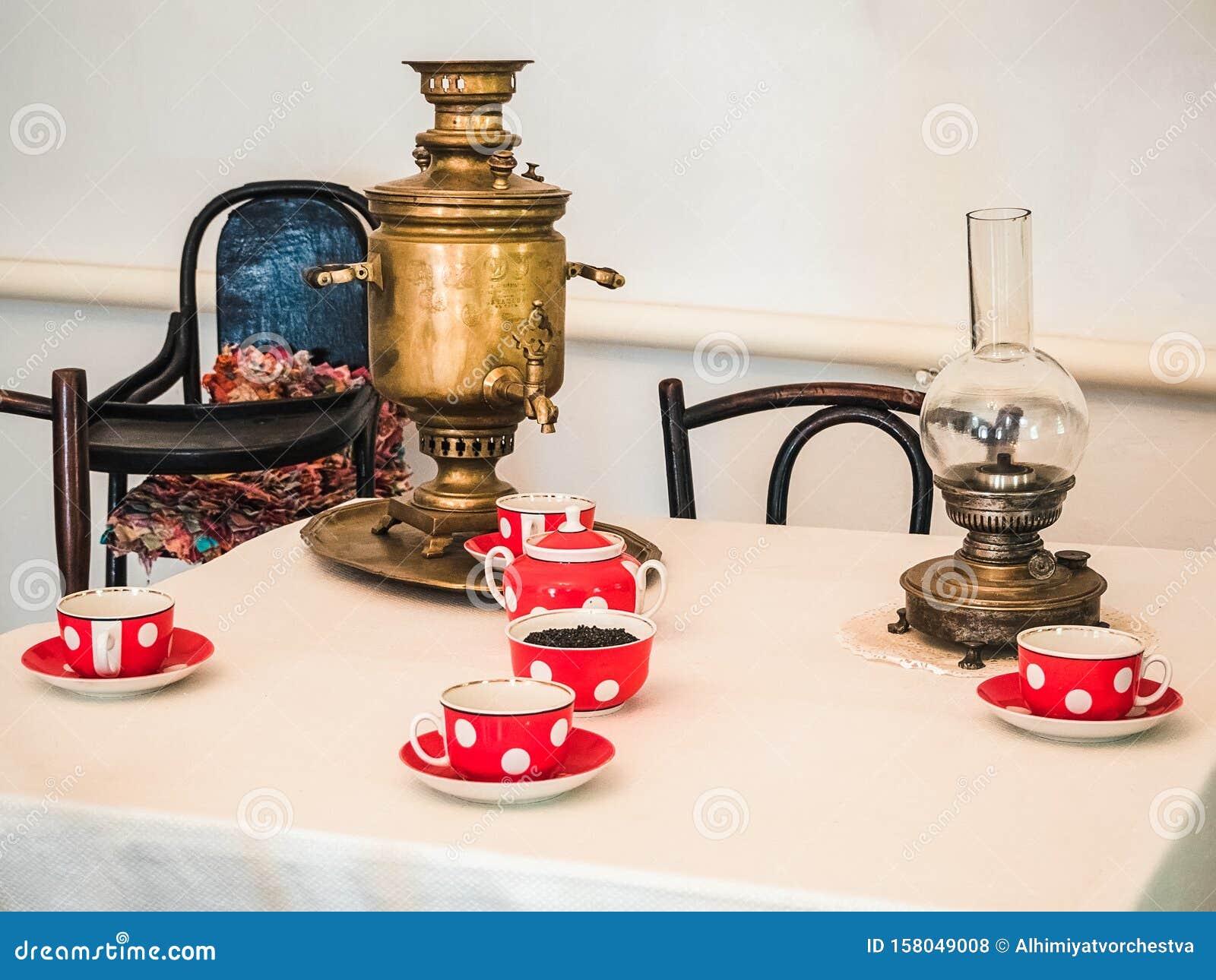 Attributes for Tea Drinking an Old Copper Samovar and Red Tea Cups