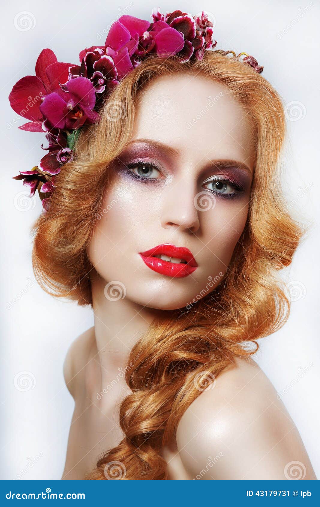 exquisite auburn woman with wreath of flowers and tress