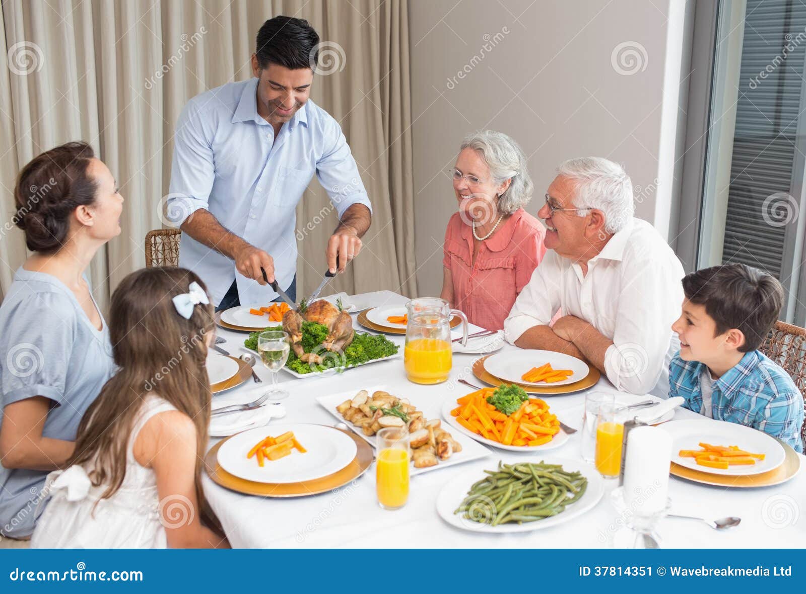 Extended Family at Dining Table in House Stock Image Image of