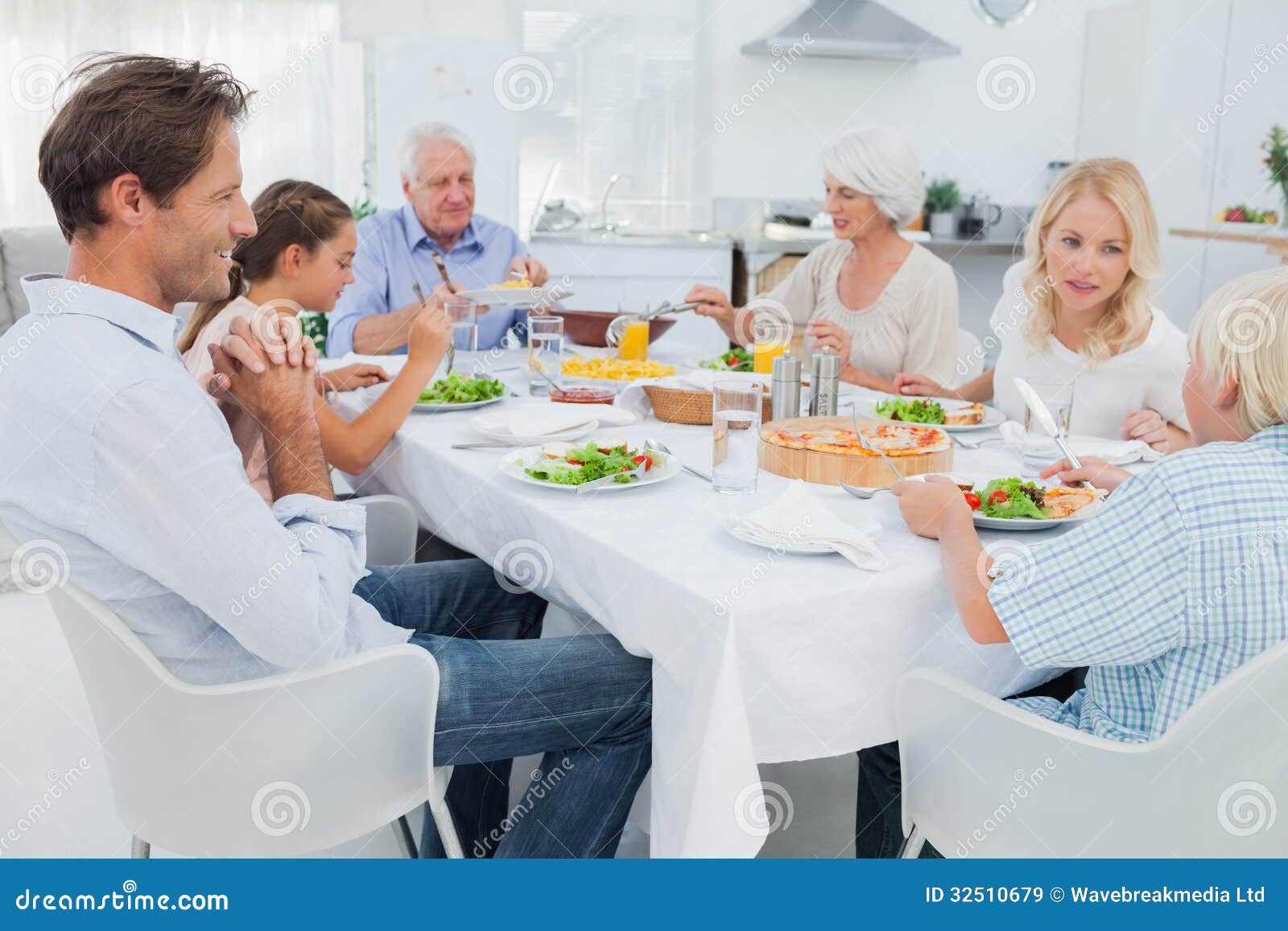Extended Family At The Dinner Table Royalty Free Stock Images Image