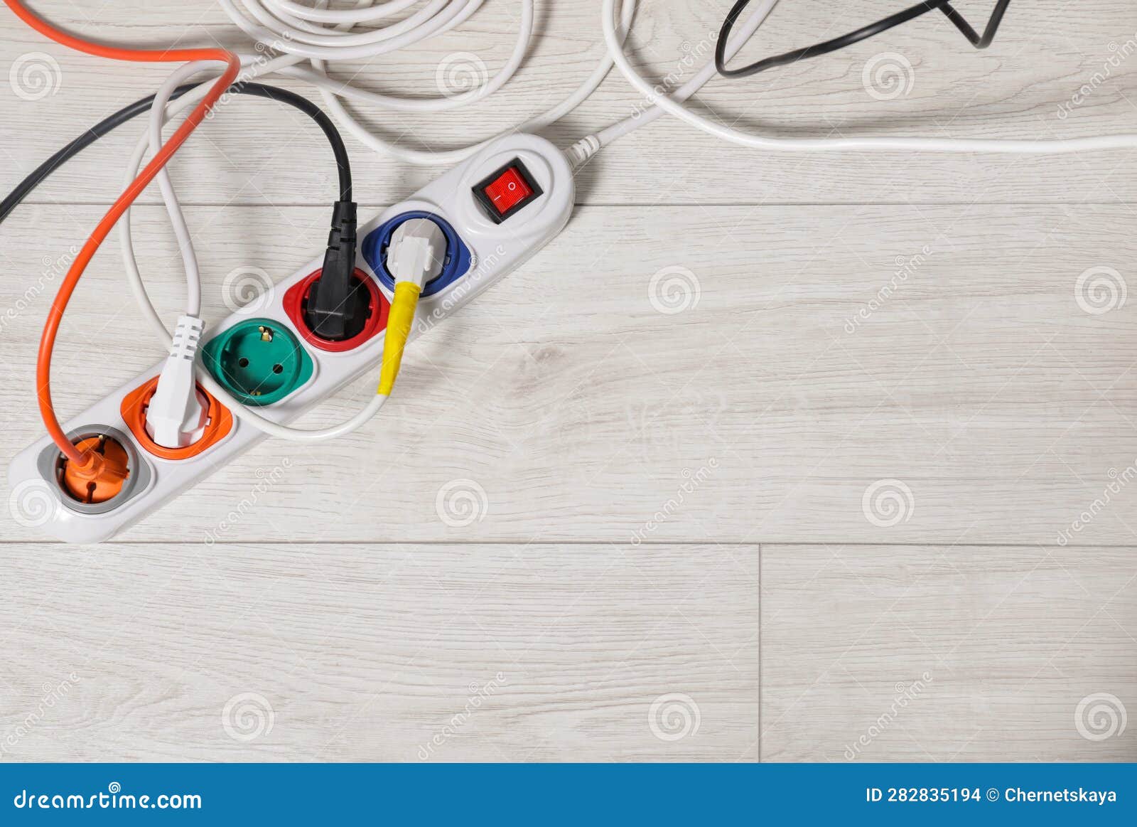 Extension Cord with Electrical Plugs on White Floor, Flat Lay. Space