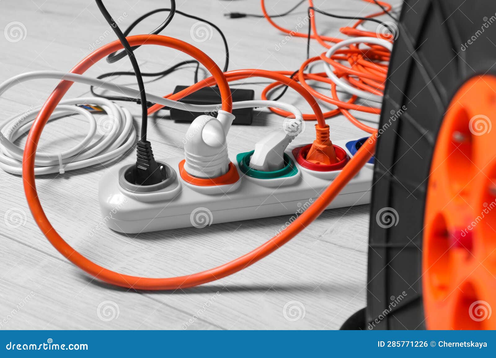 Extension Cord Reel Plugged into Power Strip Indoors, Closeup ...