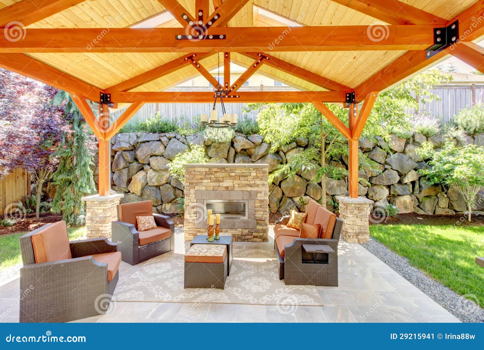 Exterior Covered Patio With Fireplace And Furniture Stock Image