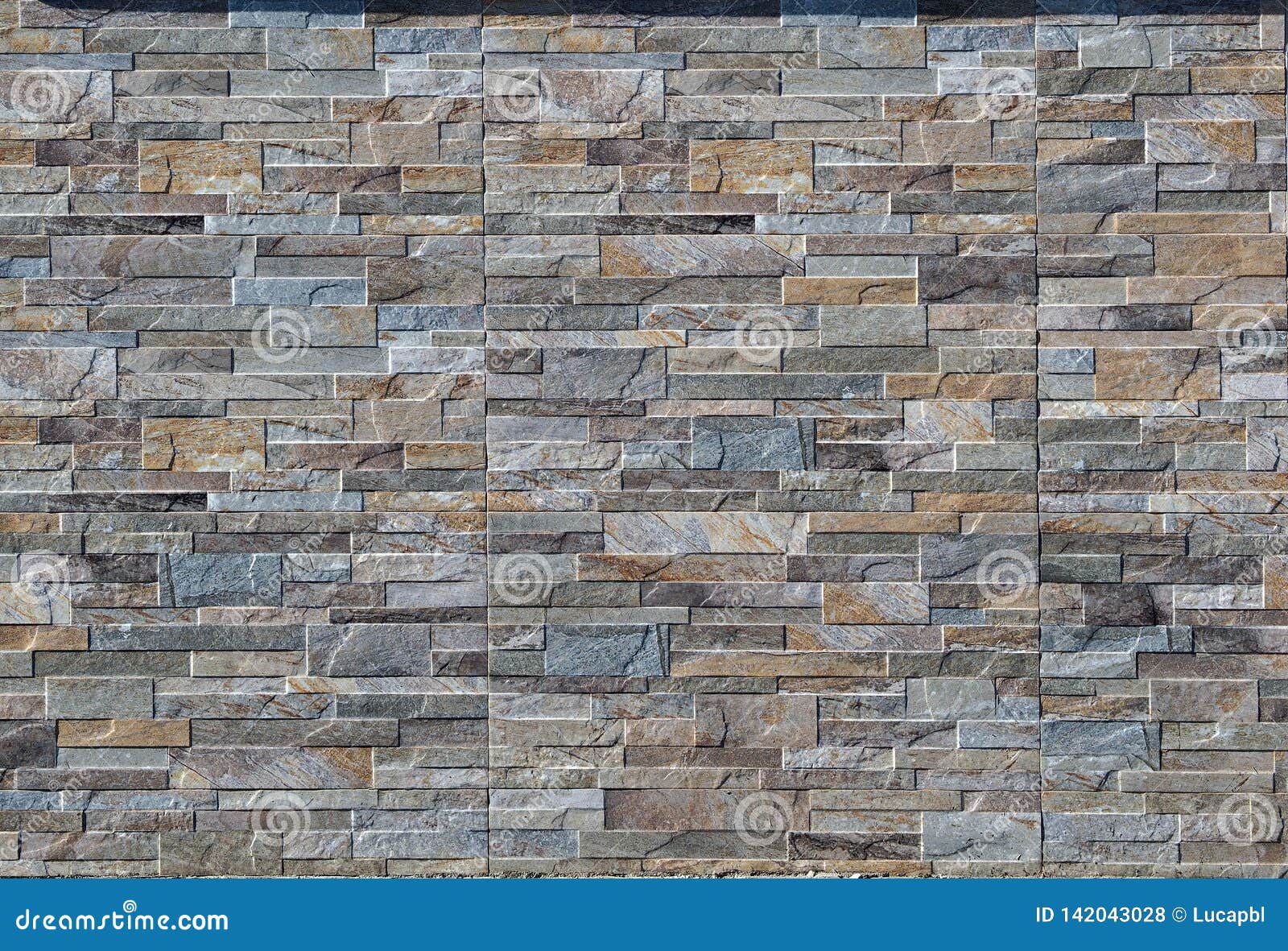 Exterior Wall Made of Stoneware Paneling with Natural Stone Effect. Background and Texture Stock