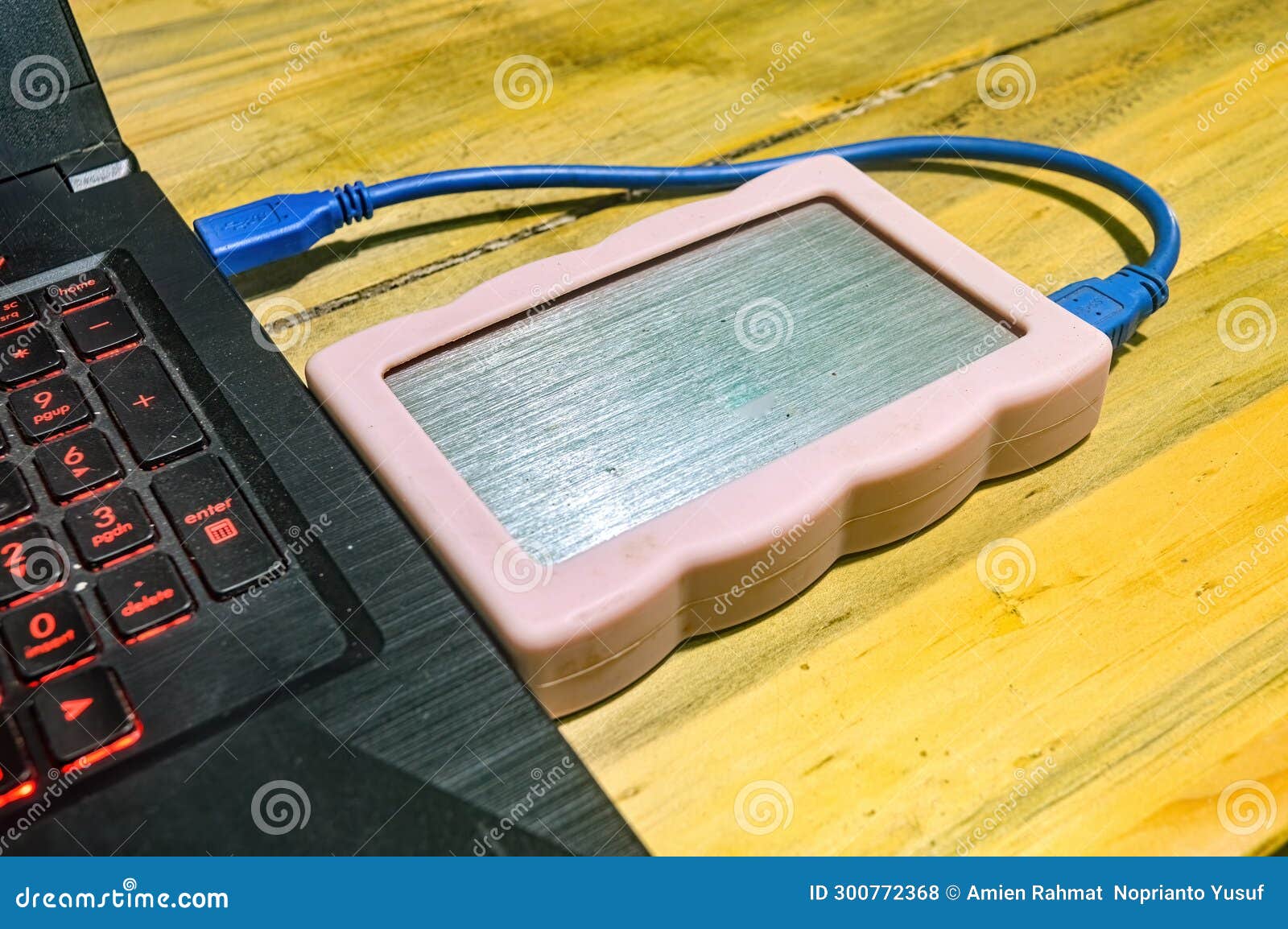 An External Hard Disk Connected To a Laptop Using a USB Cable Stock Photo Image of device
