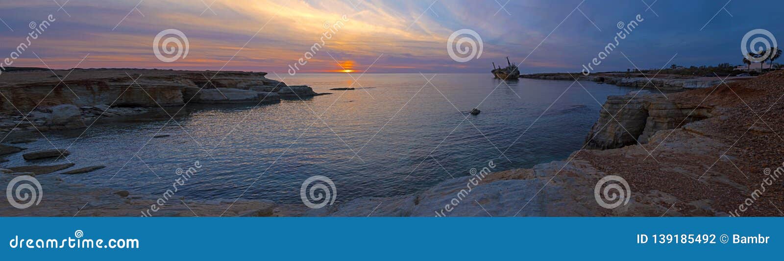 extra wide panorama of beautiful seascape and shipwreck.